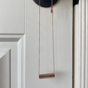 Rose Gold Michael Kors necklace.